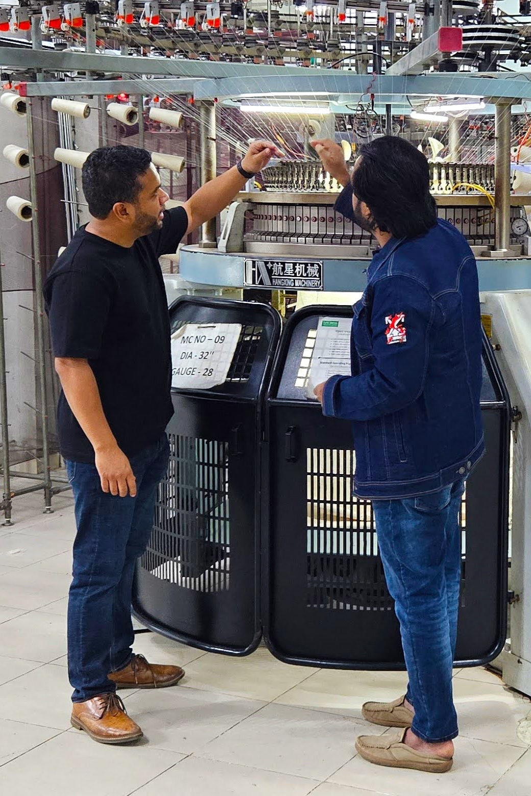Textile sourcing professional inspecting yarn quality at a supplier